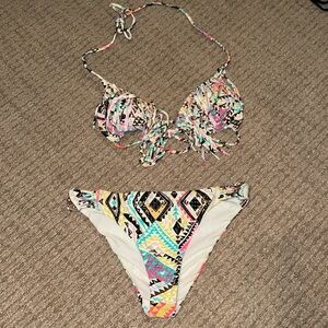 Size small runs smaller so more like an xs oneil bathing suit